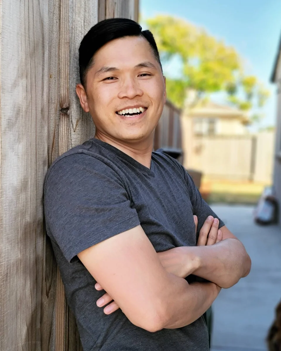 Anthony Do smiling outdoors